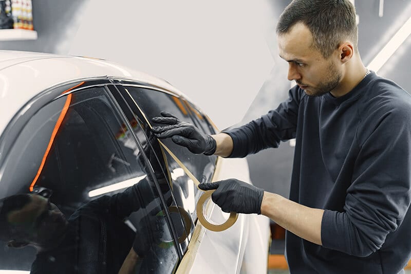 Preparing a car before spray painting