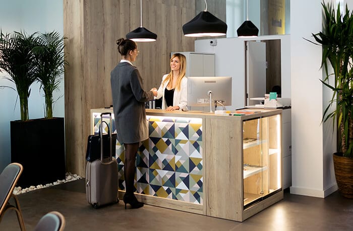 business lady checking in at a hotel