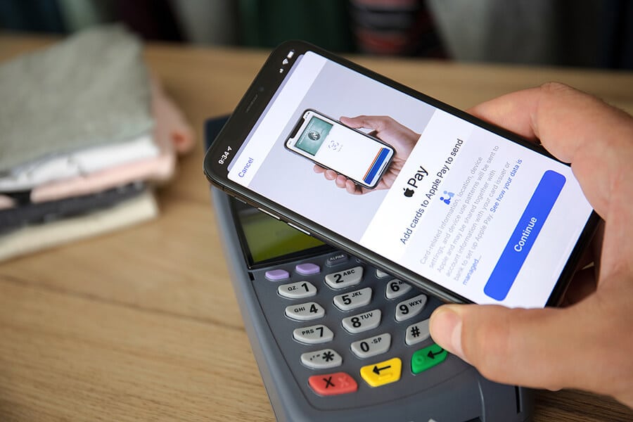 Customer paying with apple pay at the checkout